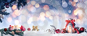 Beautiful composition with vintage Christmas lantern and festive decorations on snow against color background, banner design.