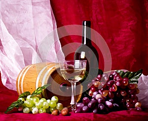 Beautiful composition with wine, grape and barrel