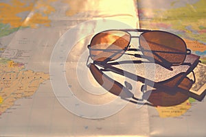 Beautiful concept for summer travel. Sunglasses with passport. Planning a summer vacation and holidays.