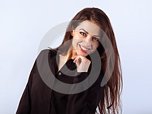 Beautiful confident calm thinking smiling business woman standing and looking black cotton style shirt on blue light background