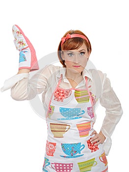 Beautiful cooking woman in apron and kitchen glove