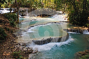 Beautiful and cool azure-colored Kuang Si waterfall near Luang Prabang