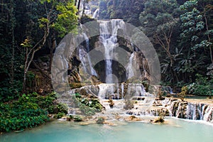 Beautiful and cool azure-colored Kuang Si waterfall near Luang Prabang