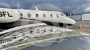 Beautiful corporate jet with raindrops on the wing