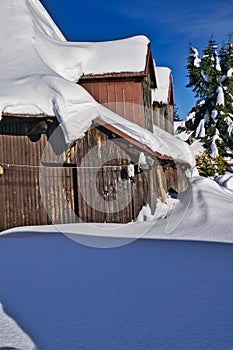 Beautiful cottage during winter in Donovaly with snow