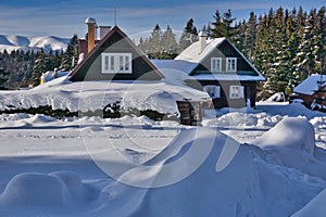 Beautiful cottages during winter in Donovaly with snow