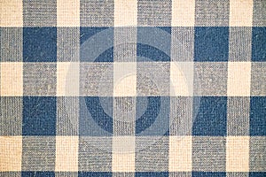 Beautiful cotton fabric in shades of dyed blue and white checker pattern background