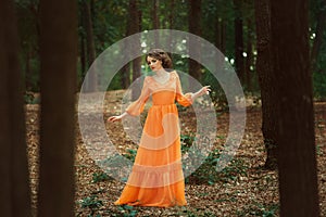 The beautiful countess in a long orange dress