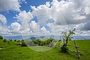 Beautiful countriside landscape in spingtime under a blue sky with clouds, Italy.