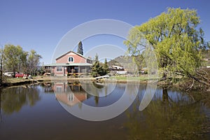 Beautiful country house next to a pond with a beautiful reflection