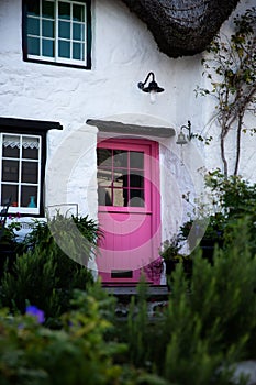 A beautiful countryside cottage with pink door