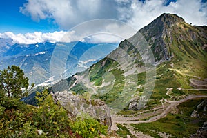 Beautiful countryside in the mountains sunny day. Beautiful spring landscape in the mountains. Grassy field and hills