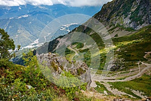 Beautiful countryside in the mountains sunny day. Beautiful spring landscape in the mountains. Grassy field and hills