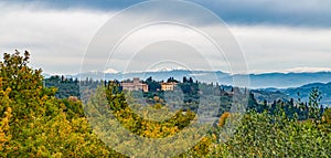 Beautiful countryside view in Tuscany, Italy. Farm landscape with grape vine rows and olive trees grove. Autumn in Italy