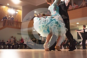 Beautiful couple in active ballroom dance photo