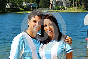 Beautiful couple with argentine jerseys celebrating soccer world cup 2018