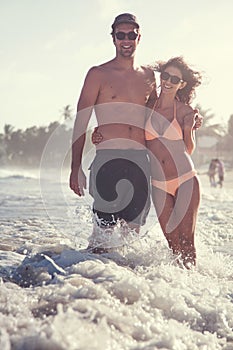 Beautiful Couple on the beach Having Fun