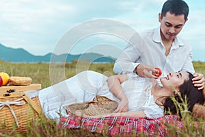 Beautiful couple enjoying picnic time on the morning