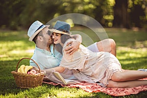 Beautiful couple enjoying picnic time outdoor