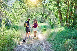 Beautiful couple of hiker wearing backpack smiling happy