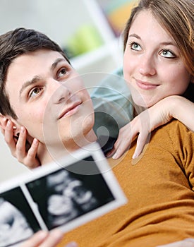 Beautiful couple imagines the future of their unborn child