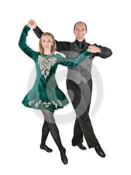 Beautiful couple in Irish dance green dress isolated
