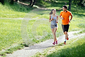 Beautiful couple jogging in nature