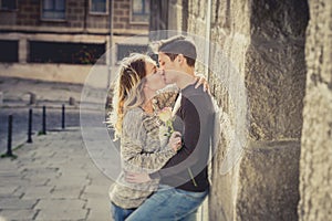Beautiful couple in love kissing on street alley celebrating Valentines day