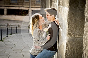 Beautiful couple in love kissing on street alley celebrating Valentines day