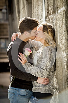 Beautiful couple in love kissing on street alley celebrating Valentines day