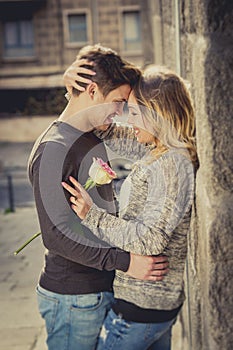 Beautiful couple in love kissing on street alley celebrating Valentines day