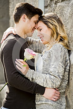 Beautiful couple in love kissing on street alley celebrating Valentines day