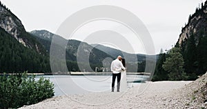 Beautiful couple in love ,staying close-up with each other,background amazing lake and perfect green mountains.RED epic