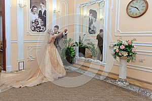 Beautiful couple in love. Wedding ceremony. REGISTRY OFFICE. Newlyweds in a beautiful room