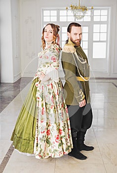 Beautiful couple man and woman in medieval costumes