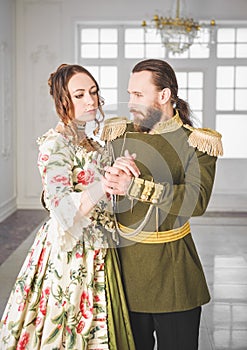 Beautiful couple man and woman in medieval costumes