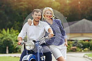 Beautiful couple on retro motorbike