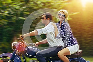 Beautiful couple on retro motorbike