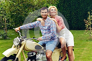 Beautiful couple on retro motorbike