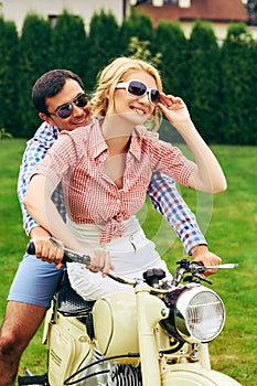 Beautiful couple on retro motorbike