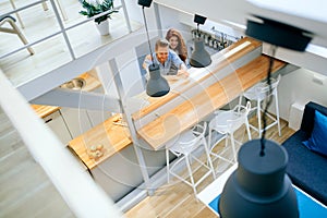 Beautiful couple in well designed kitchen