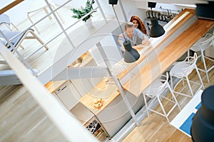 Beautiful couple in well designed kitchen