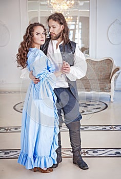 Beautiful couple woman and man in medieval clothes