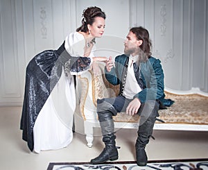 Beautiful couple woman and man in medieval clothes