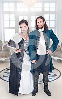 Beautiful couple woman and man in medieval clothes