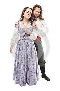 Beautiful couple woman and man in medieval clothes isolated