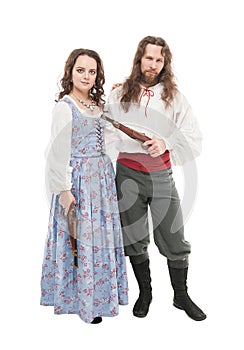 Beautiful couple woman and man in medieval clothes with pistols