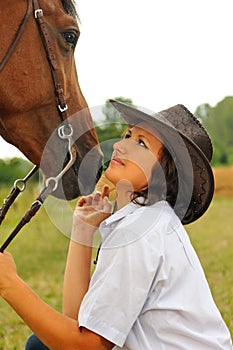 Beautiful cowgirl with her horse