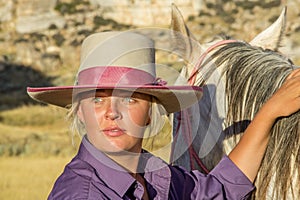 Beautiful Cowgirl With Horse photo
