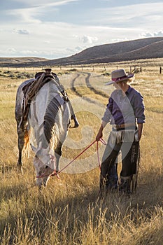 Beautiful Cowgirl With Horse photo